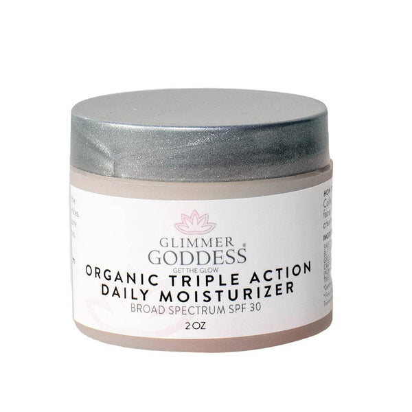 Glimmer Goddess organic triple action daily moisturizer jar on a white background