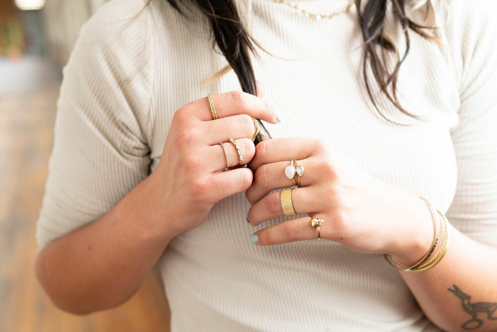Fair Anita Moonstone Warrior Ring shown on hand — adjustable fit, recycled brass, ethical jewellery
