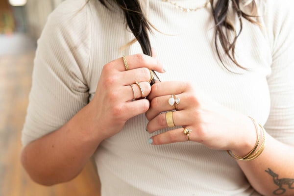 Fair Anita Moonstone Warrior Ring shown on hand — adjustable fit, recycled brass, ethical jewellery