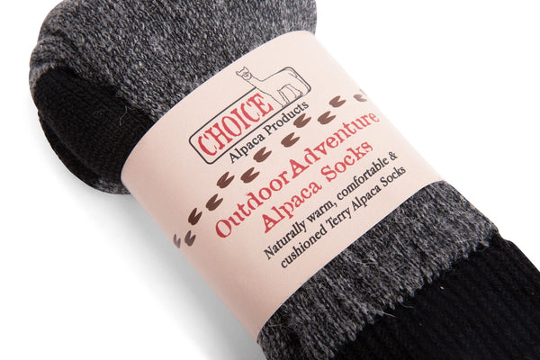 Gray alpaca socks with a label on a white background