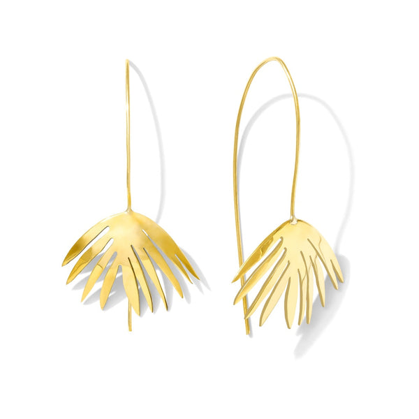 Gold leaf-shaped earrings on a white background