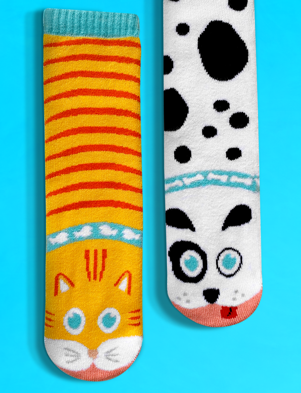 Add a playful touch to your wardrobe with these adorable mismatched cat and dog socks. These eco-friendly and comfortable socks are perfect for anyone who loves animals and unique style.