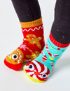 Add a touch of holiday cheer to your wardrobe with our Gingerbread & Candy Cane mismatched socks. These cozy and comfortable socks are perfect for the whole family.