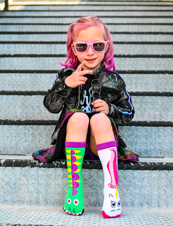 Discover the magic of our Dragon & Unicorn Mismatched Socks. These playful socks are perfect for adding a touch of enchantment to your child's wardrobe. Not only are they fun and stylish, but they also promote empathy and acceptance. Order yours today!