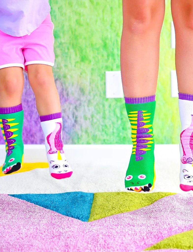 Discover the magic of our Dragon & Unicorn Matchy Mismatched Socks. This adorable set features sparkly designs and is perfect for sharing with a loved one. Not only are they fun and stylish, but they also promote empathy and acceptance. Order yours today!