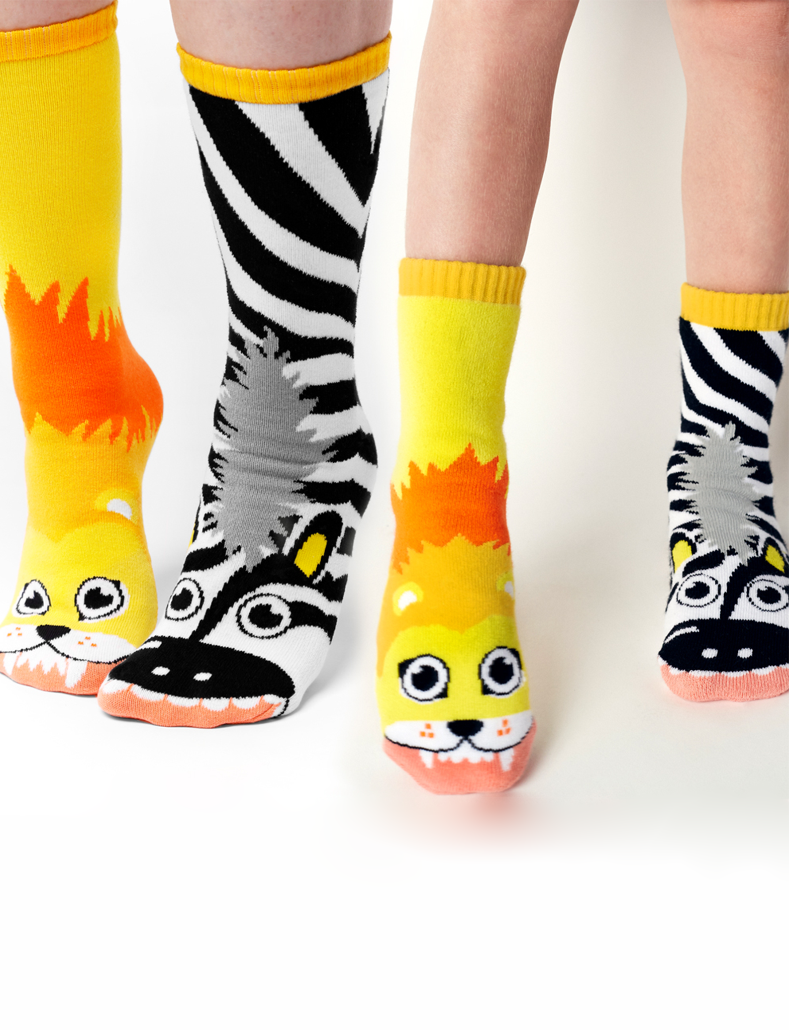 Discover the magic of our Lion & Zebra Matchy Mismatched Socks. This adorable set features playful animal designs and is perfect for sharing with a loved one. Not only are they fun and stylish, but they also promote empathy and acceptance. Order yours today!