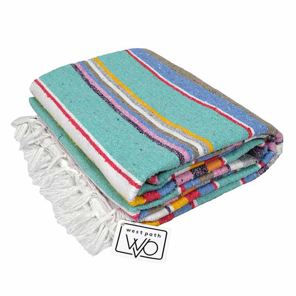 Colorful striped towel with tassels on a white background, featuring the brand 'West Path'.