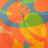 Colorful abstract pattern with orange, green, and blue shapes on a fabric background