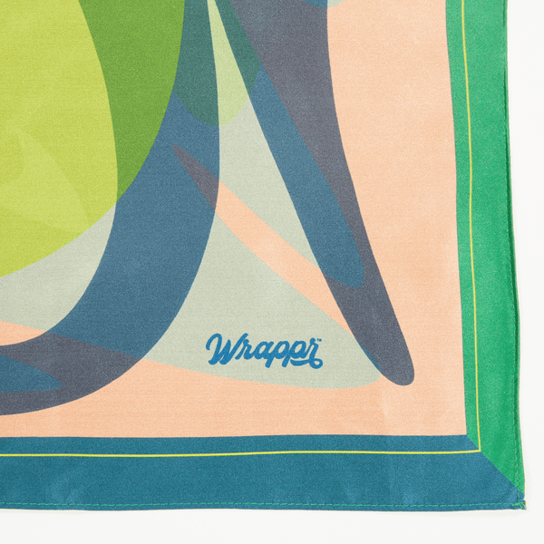 Colorful fabric with abstract patterns and 'Wrapper' branding on a white background