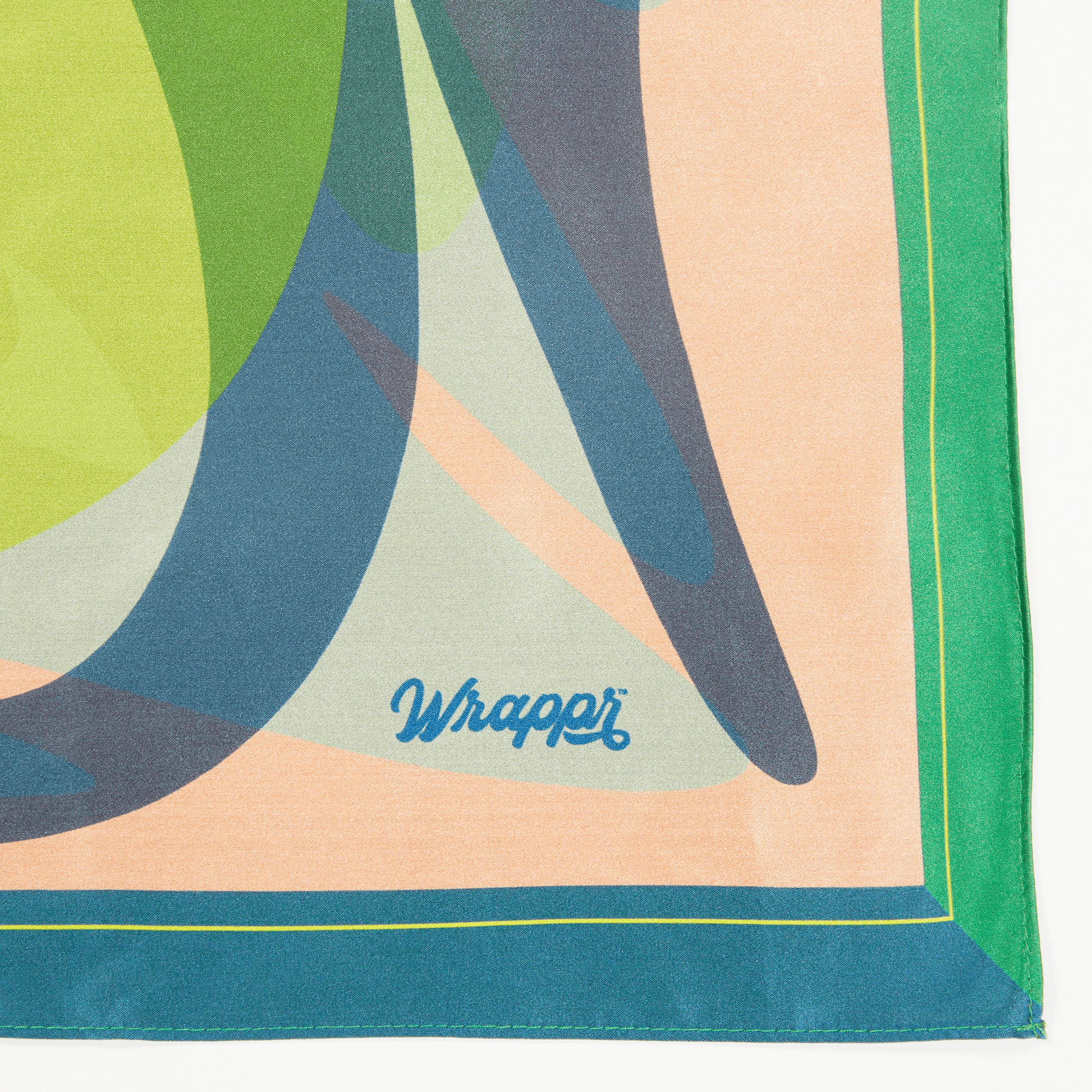 Colorful abstract patterned fabric with 'Wrapper' branding.