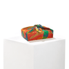 Patient Fire furoshiki wrap styled as a reusable gift wrap around a present, showcasing the silk print detail