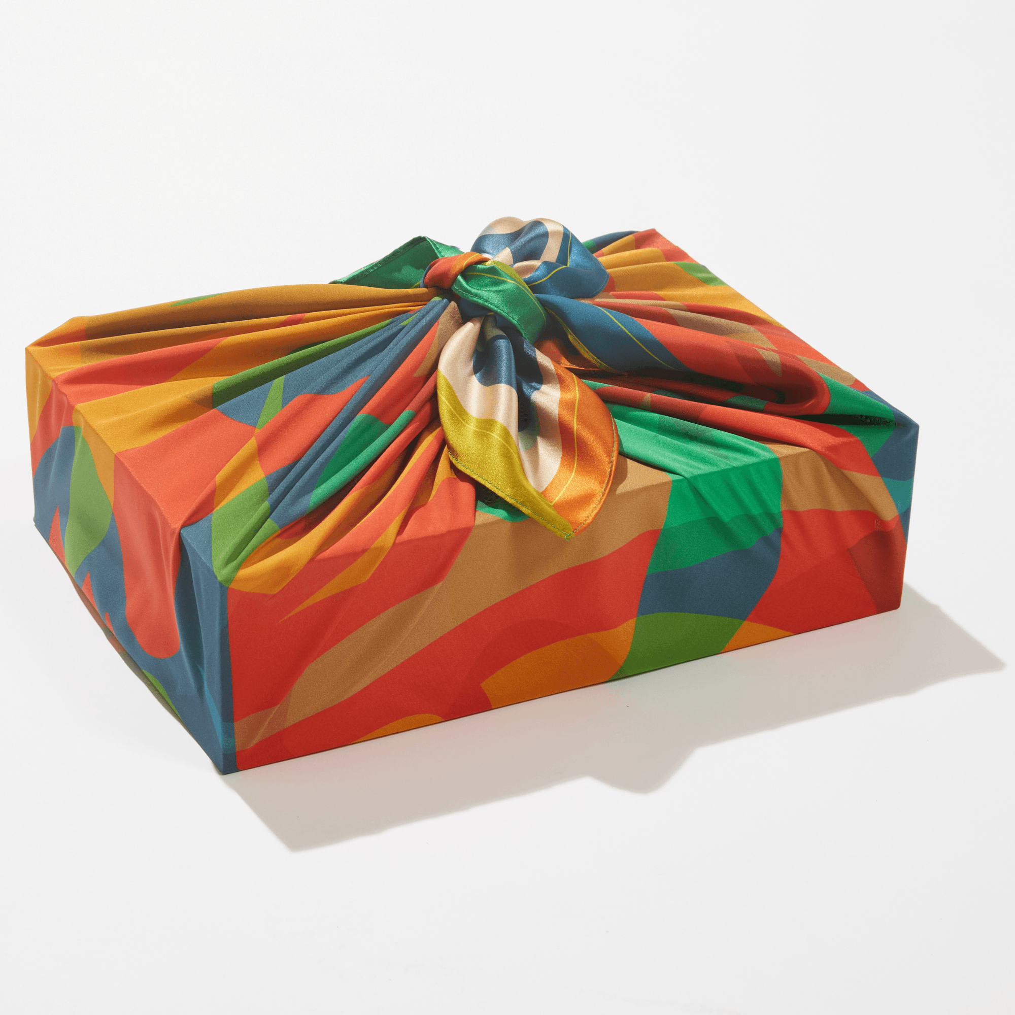 Colorful fabric wrap on a box with a white background