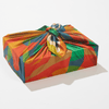 Colorful fabric wrap on a box with a white background