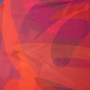 Close-up of colorful fabric with abstract patterns in reds and oranges.