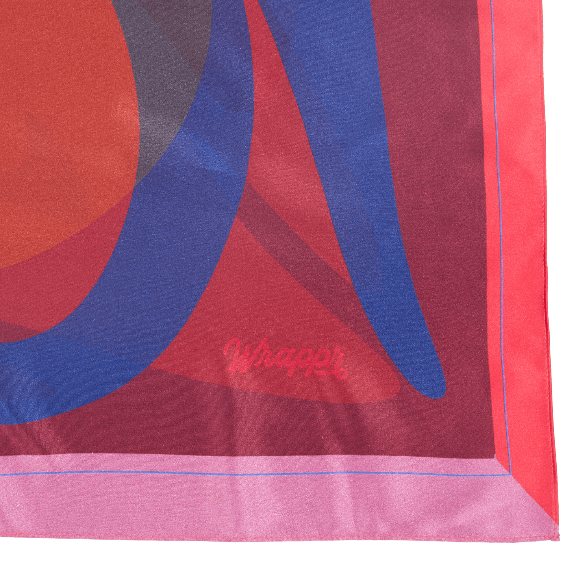 Colorful fabric with abstract design and 'Wrapper' branding on a white background