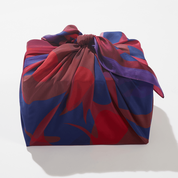 Colorful fabric bag with abstract pattern on a white background