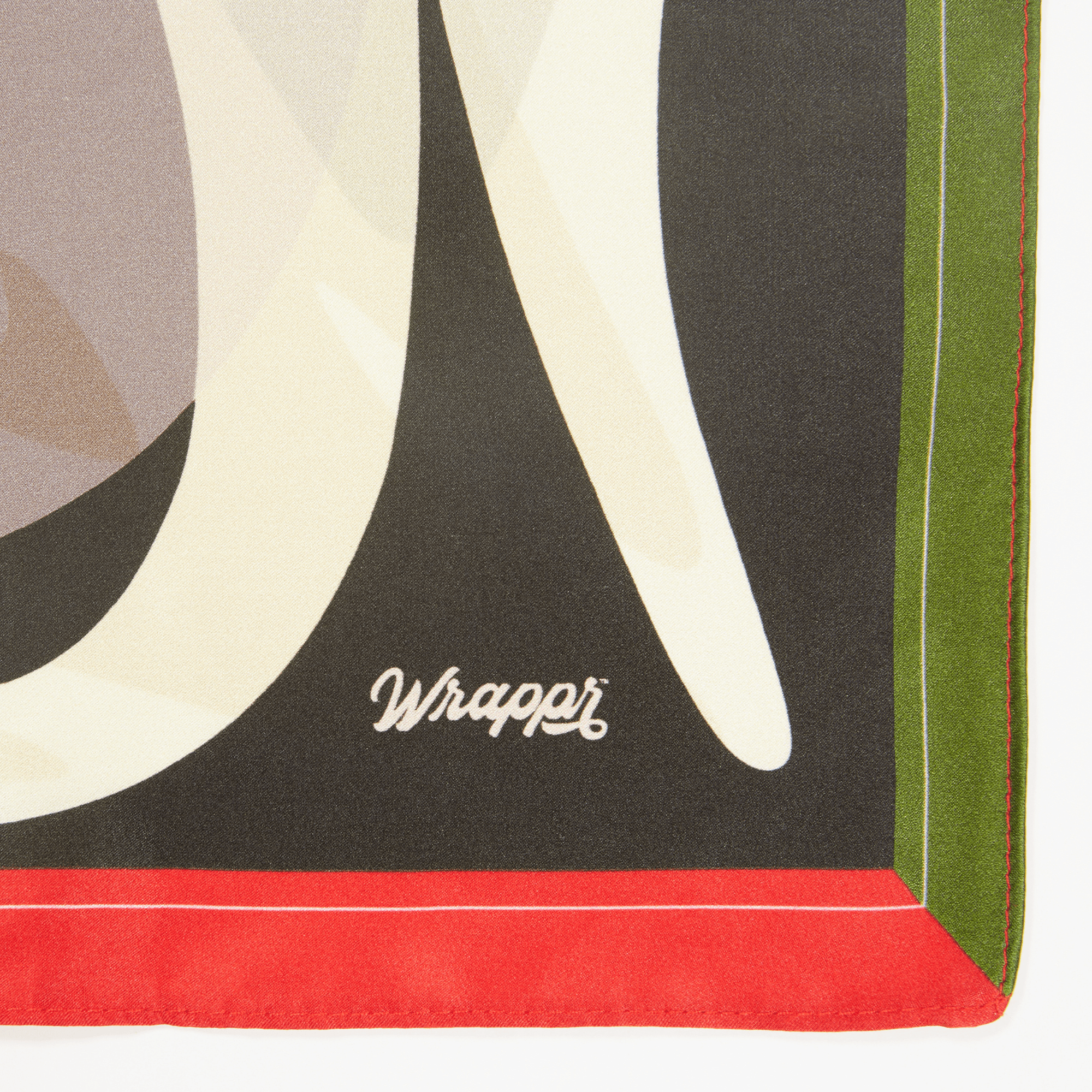 Close-up of a decorative paper with geometric shapes and the brand 'Wrapper' visible.