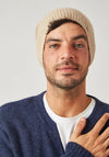Close-up of intricate open knit texture on pearl white baby alpaca beanie