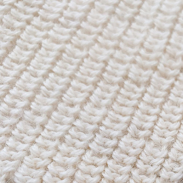Handcrafted Peruvian baby alpaca beanie hat in pearl white, detail shot