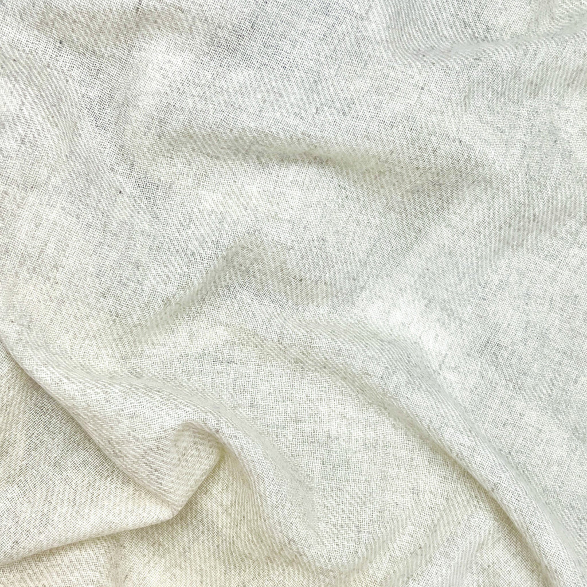 Close-up of beige cashemere with a soft texture