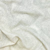 Close-up of beige cashemere with a soft texture