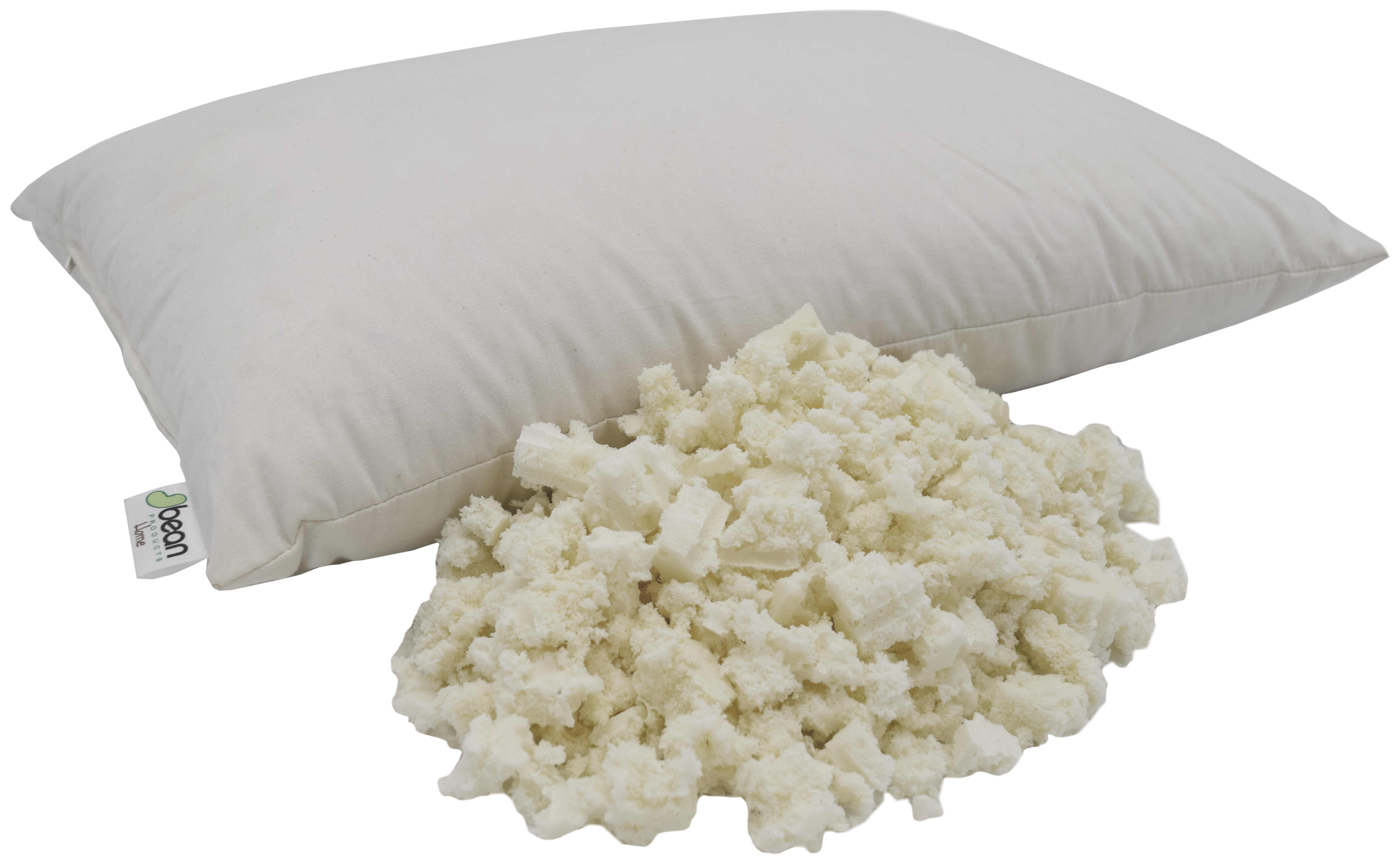White pillow with a small tag next to a pile of white fluffy material on a white background