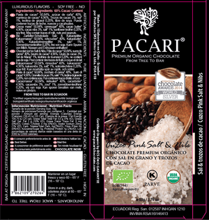 Pacari chocolate packaging with a wooden spoon and cacao beans