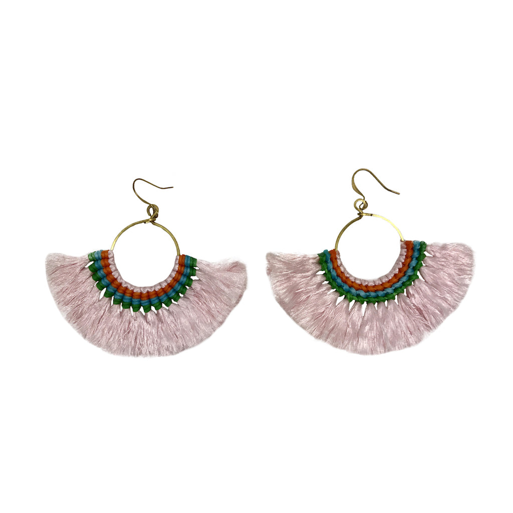 Pair of pink tassel earrings with green and orange accents on a white background