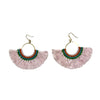 Pair of pink tassel earrings with green and orange accents on a white background