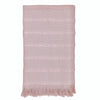 Pink textured rug with fringes on a white background