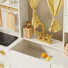 Tiny Land iconic wooden play kitchen in cream showing full layout with stovetop, oven and storage compartments