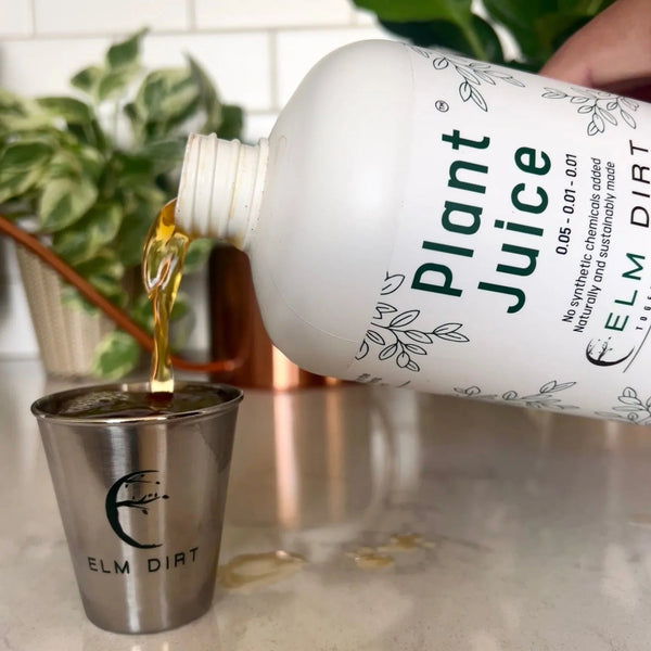 Plant Juice being poured into a metal cup with Elm Dirt branding.