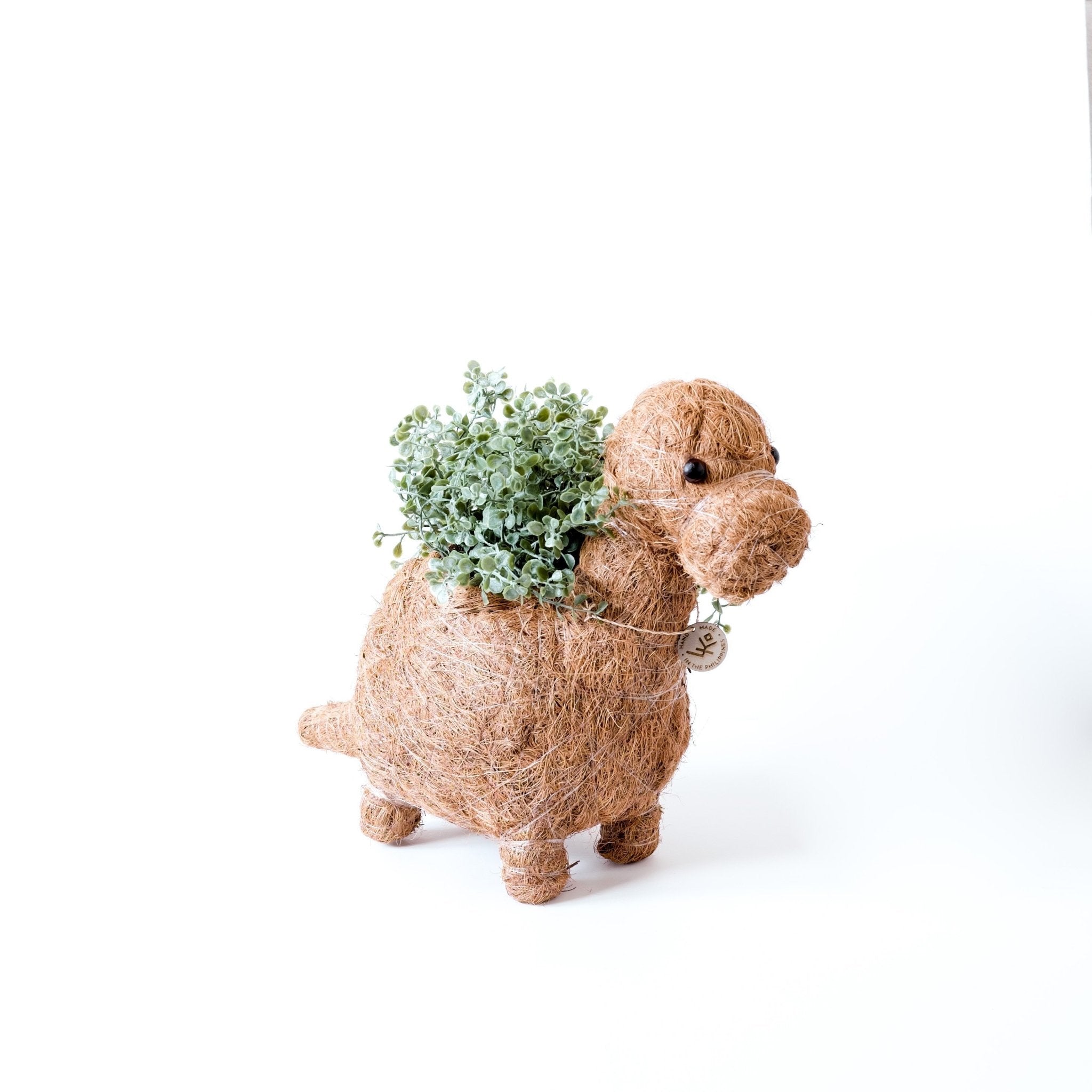 Decorative plant holder shaped like a dog with a plant on a white background