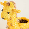 Yellow giraffe plush toy with a white background