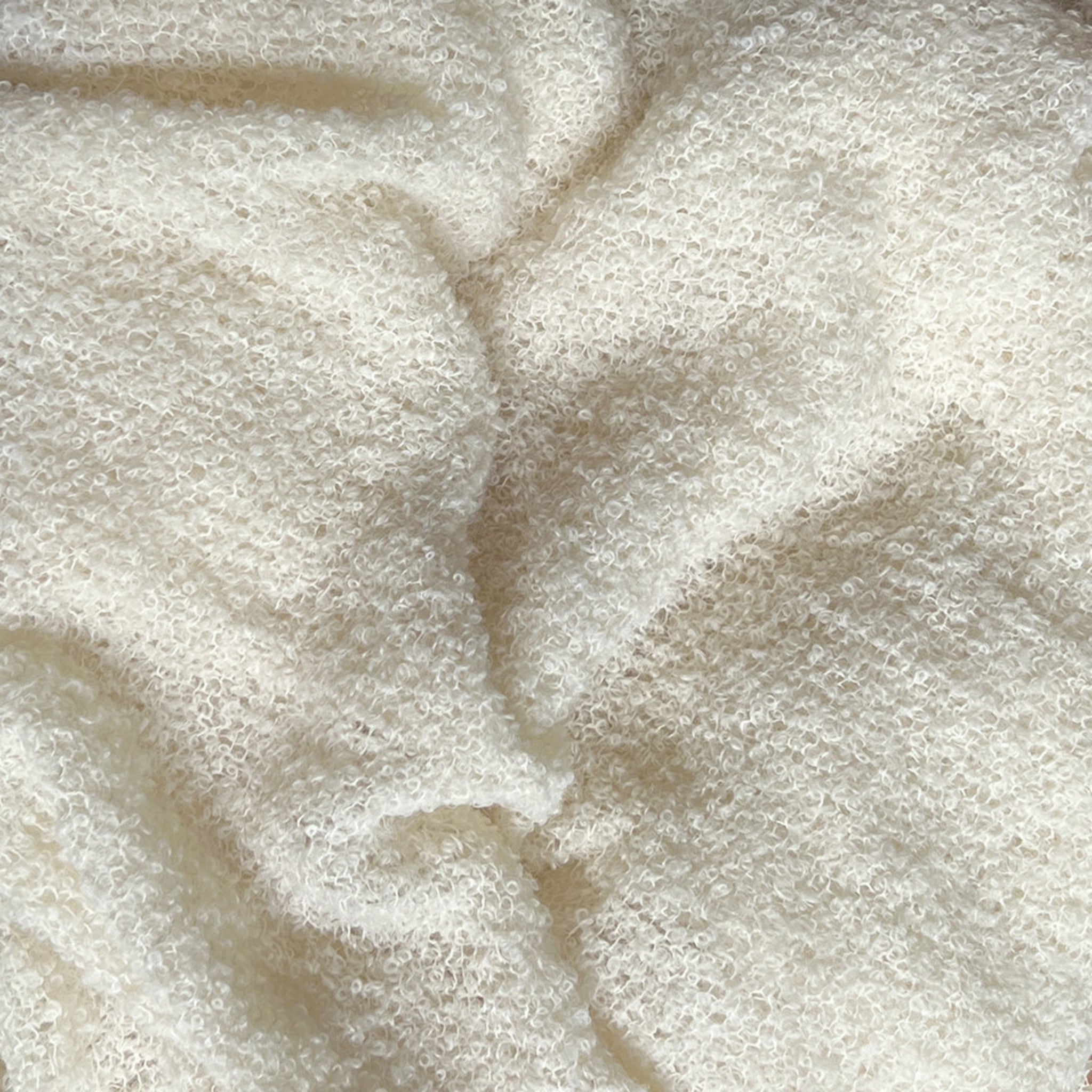 Close-up of beige fabric with a textured pattern