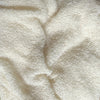 Close-up of beige fabric with a textured pattern