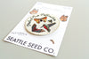 Close-up of pollinator-themed embroidered patch with iron-on backing, 3-inch size