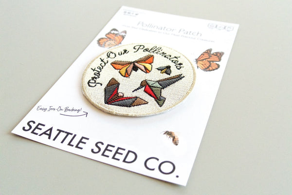 Close-up of pollinator-themed embroidered patch with iron-on backing, 3-inch size