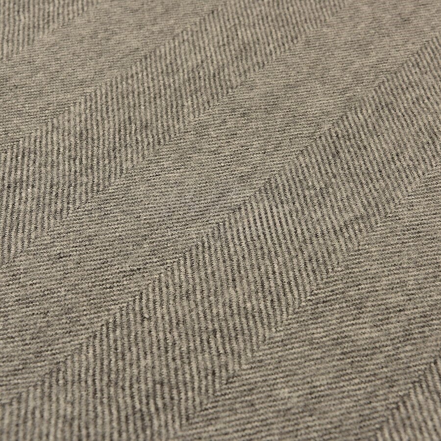Close-up of a textured gray fabric with a subtle pattern