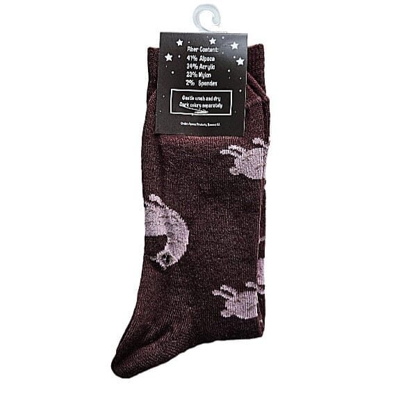 Pair of dark brown socks with light gray cloud pattern on a white background. Discover our fun Pronk & Play Alpaca Socks, featuring a cheerful design for adults and kids. Made with a soft alpaca blend, these USA-designed socks are comfortable and durable. Shop now and add a little joy to your step.