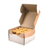 Open cardboard box containing six small candles on a white background