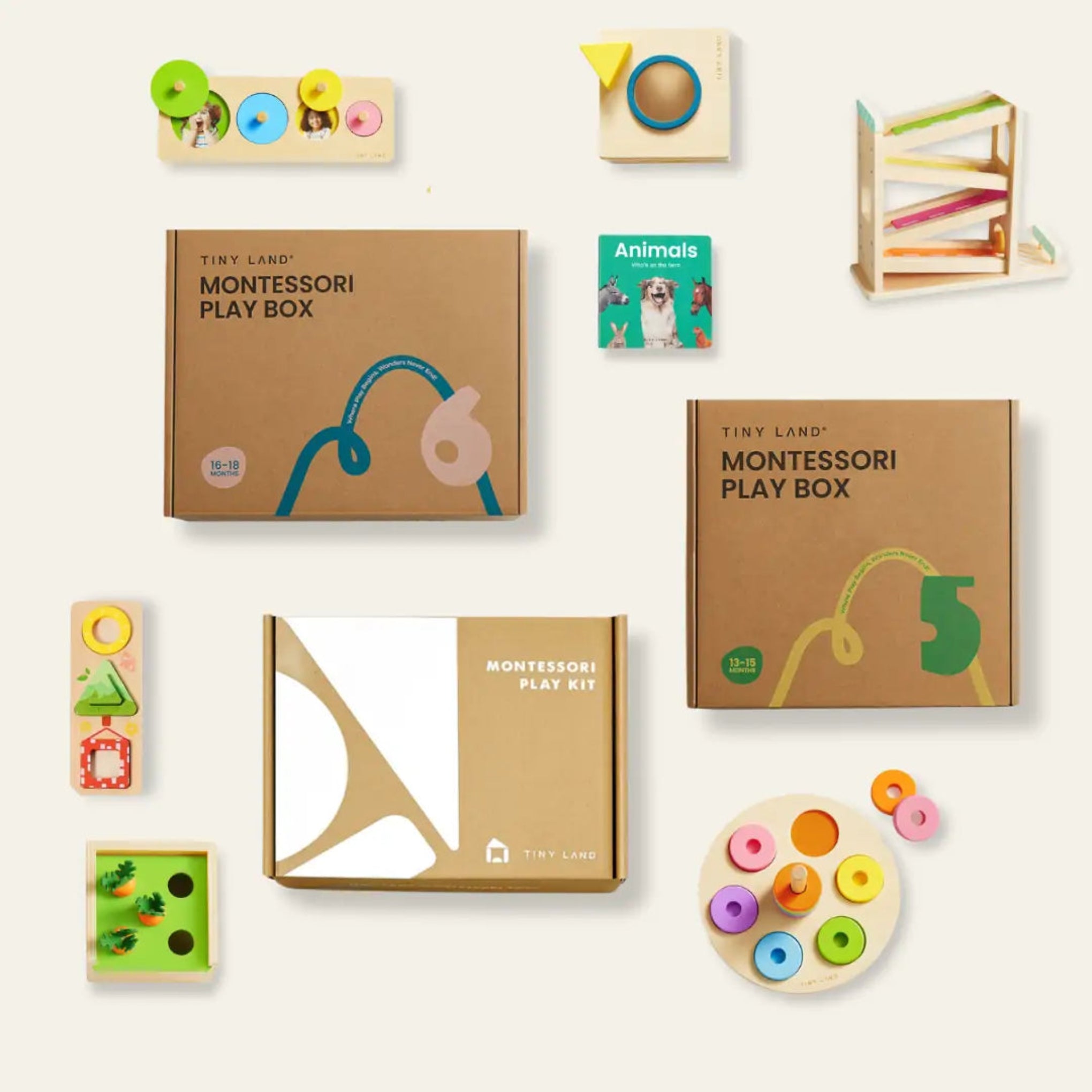 Collection of Tiny Land Montessori educational toys and play boxes on a white background