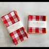 Two packages of red and white checkered napkins with 'dot&army' branding on a light gray background.
