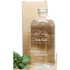 Clear glass mouthwash bottle with 'Lucky Teeth' branding on a white background
