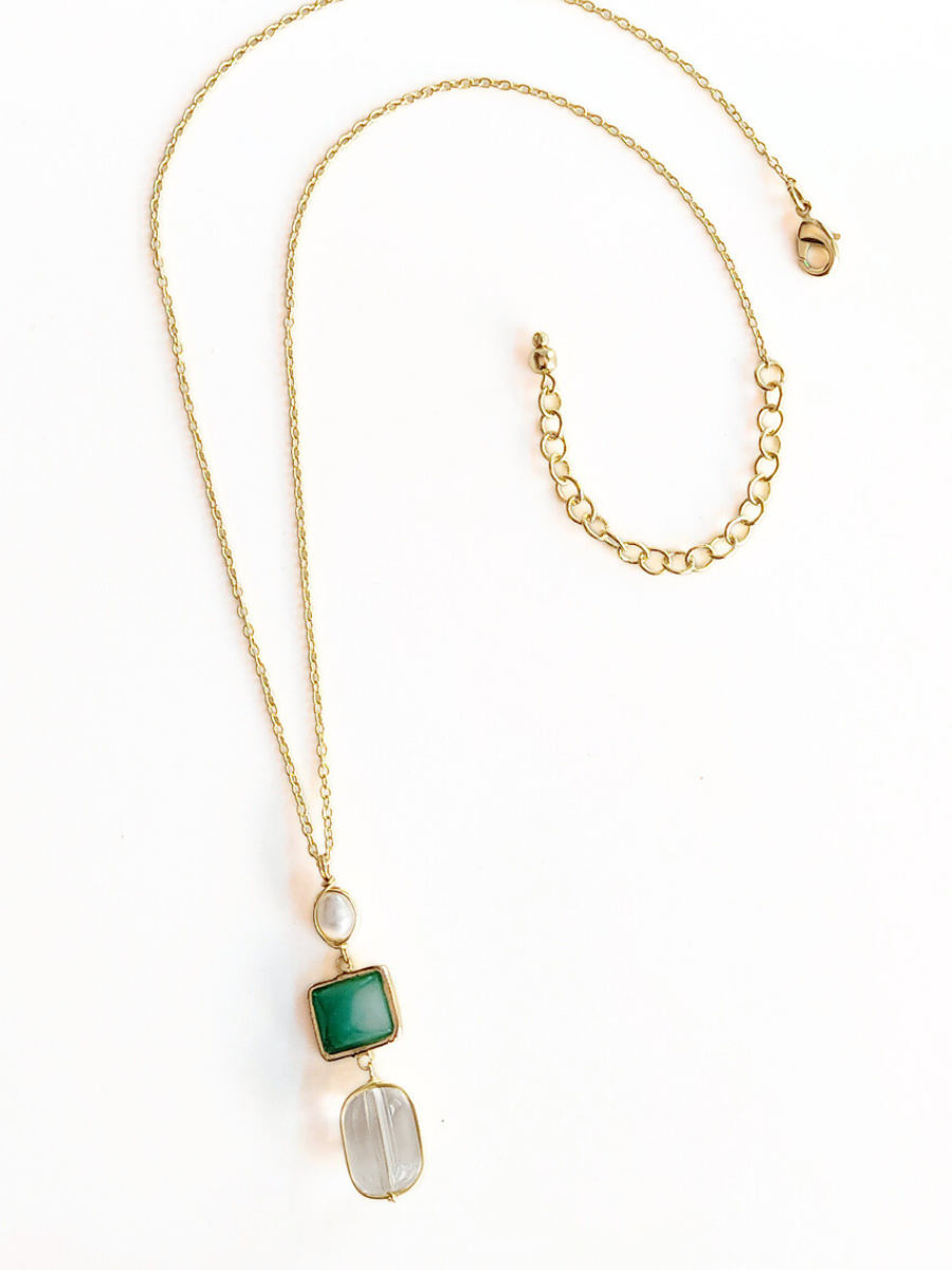 Regency Drop Pendant Necklace flat lay showing gold pendant and chain detail