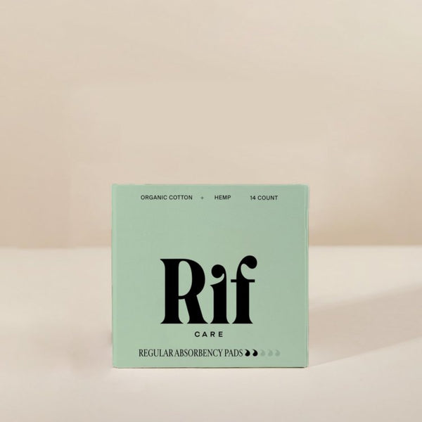 Box of Rif Care regular absorbency pads on a beige background