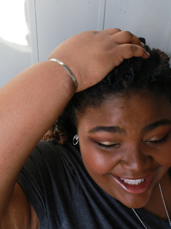 Close-up of Inhale Exhale Repeat engraved cuff bracelet, ethically handmade recycled metal bangle