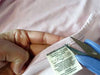 Close-up of easily removable tag on Remedywear™ adult eczema shirt for sensitive skin