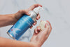 Plaine Products body wash with loofah, showing gentle daily skincare routine