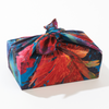 Reverse side of the Rosebud mulberry silk furoshiki wrap by Adam Klassen, showing complementary floral pattern and colours